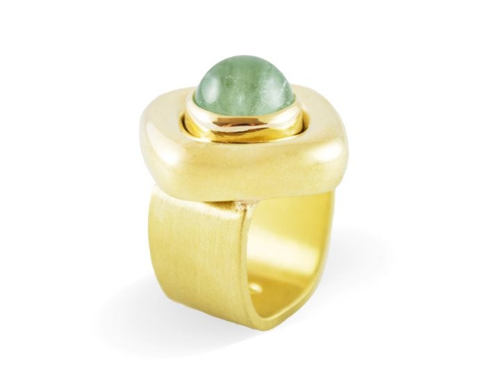 Modern blue-green aquamarine stone in a 18k gold setting atop a brushed, 18k gold band.