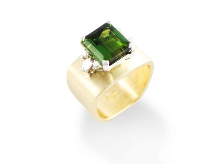 Three carat mint green tourmaline in a 14k white gold setting with 0.37 ctw prong-set diamonds on the shoulders atop a brushed 14k yellow gold band.