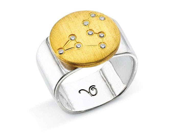 Ring of 22k gold disc atop a sterling silver band features glittering high-quality diamonds outlining star sign constellation of Leo.