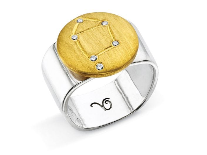 Ring of 22k gold disc atop a sterling silver band features glittering high-quality diamonds outlining star sign constellation of Libra.