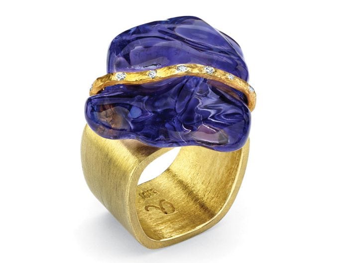 Large Tanzanite stone with a 22k gold, diamond studded ribbon atop a 18k gold square ring