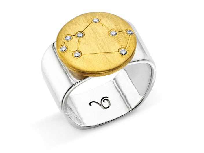 Ring of 22k gold disc atop a sterling silver band features glittering high-quality diamonds outlining star sign constellation of Sagittarius.