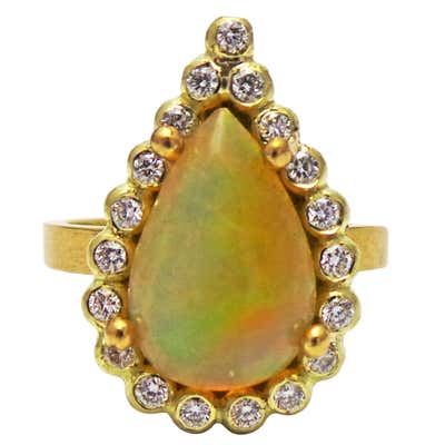 2.6 Carat Pear Shaped Ethiopian Opal Handmade Gold Diamond Halo Ring