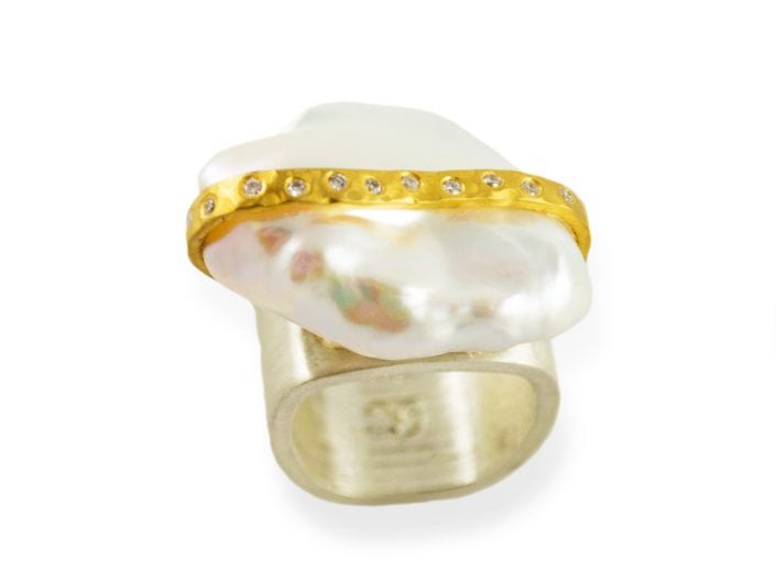 Large, baroque freshwater pearl surrounded by a 22k gold diamond-sprinkled ribbon set on a sterling silver band.